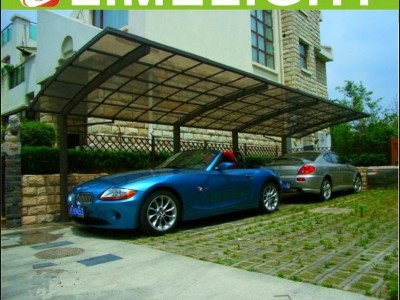 Extended aluminum carport with bronze frame and bronze polycarbonate solid sheet