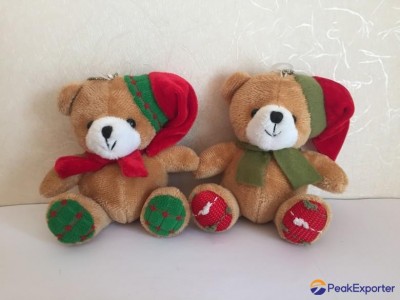 stuffed bear with christmas scarf and hat