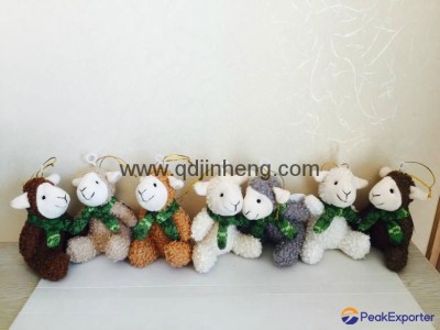 Stuffed sheep with knitted scarf